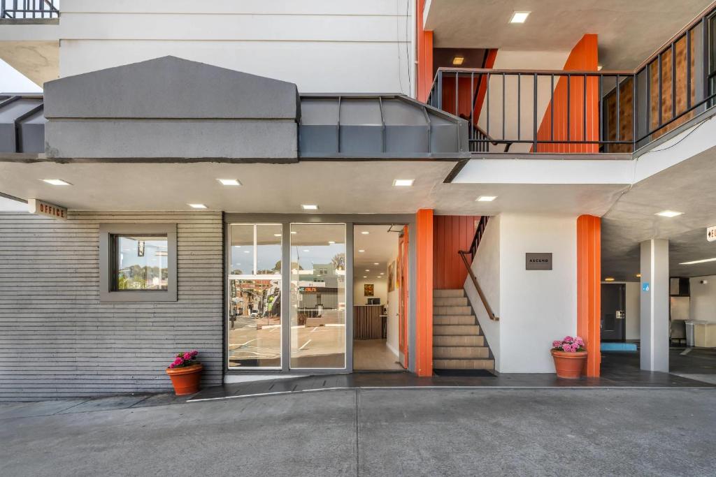 an office building with glass doors and a staircase at La Luna Inn, an Ascend Collection Hotel in San Francisco