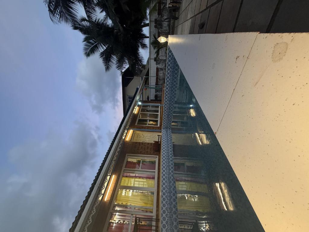 a tall building with lights on top of it at SeaBreeze in Bārsiv