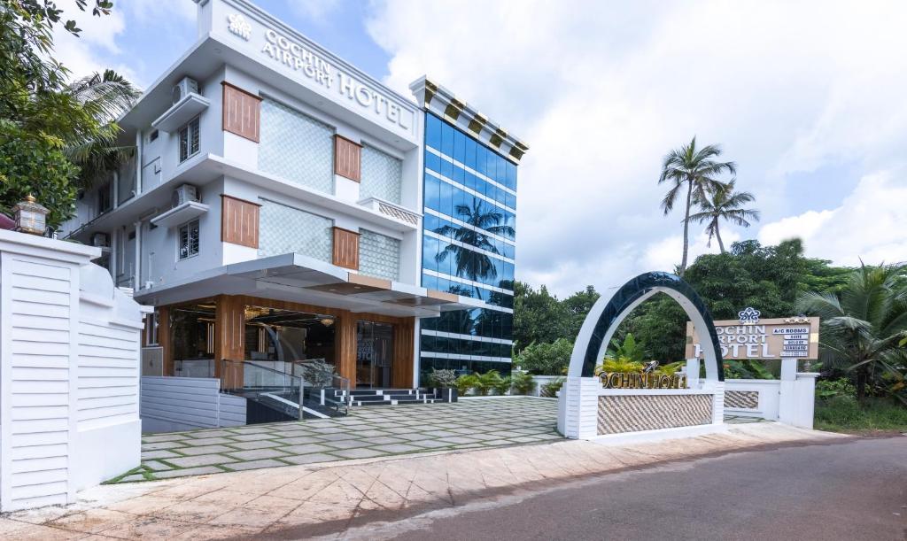 a view of the hotel from the street at Treebo Premium Cochin Airport, 5 min From Cochin Airport in Cochin