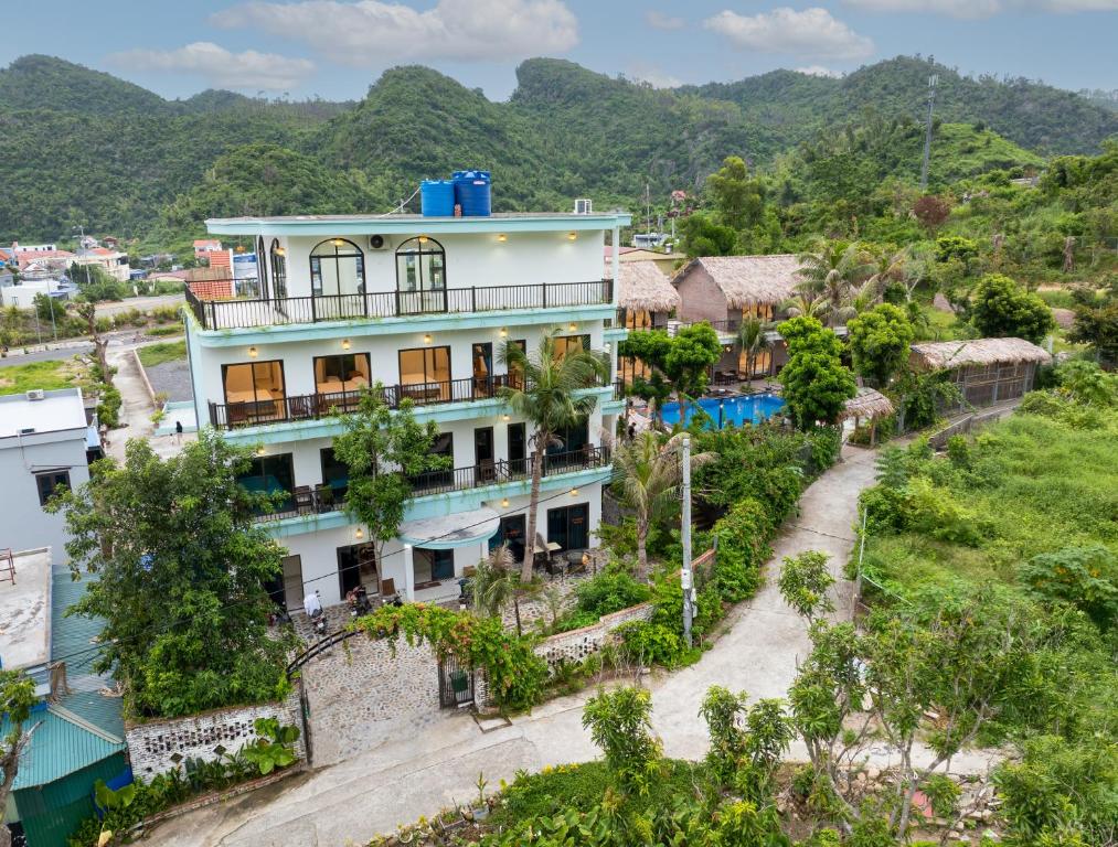 an aerial view of a building with mountains in the background at CATBA HEVEN HILLs in Xuan Dam