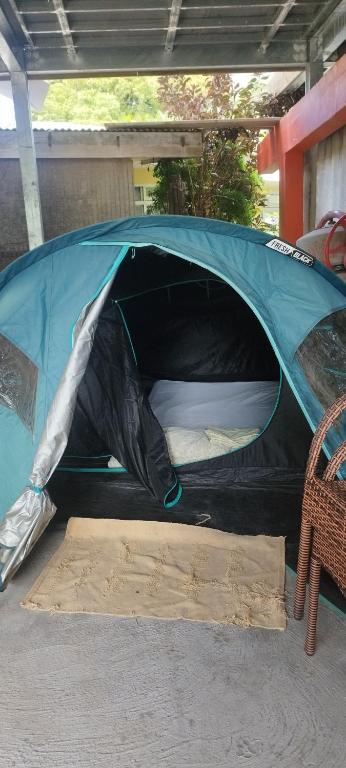 a tent is set up on a patio at Banian Camping petit déjeuner offert in Bora Bora