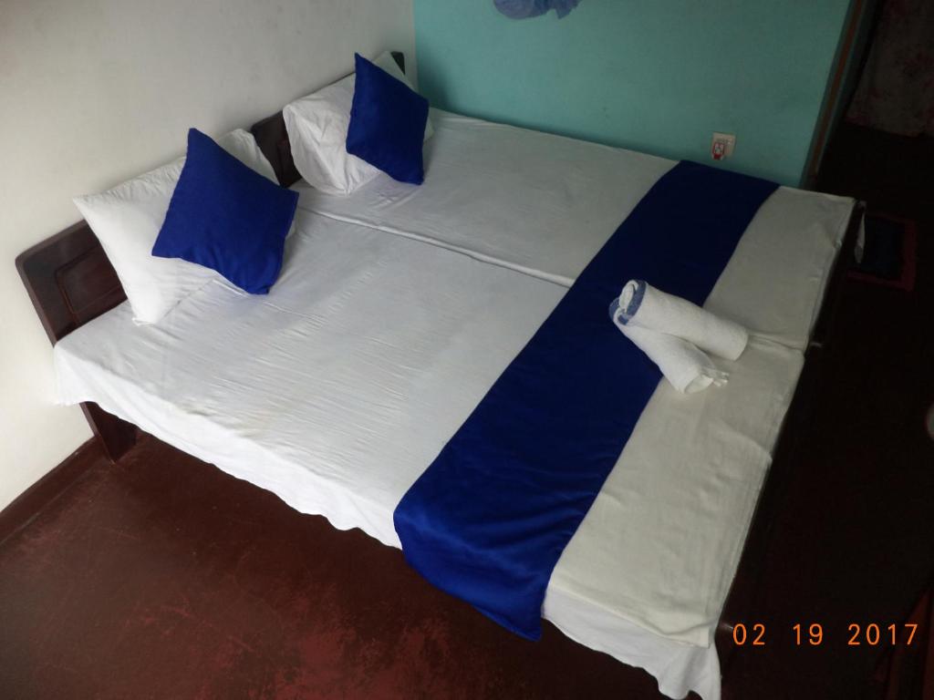 Postel nebo postele na pokoji v ubytování Raja174 Homestay