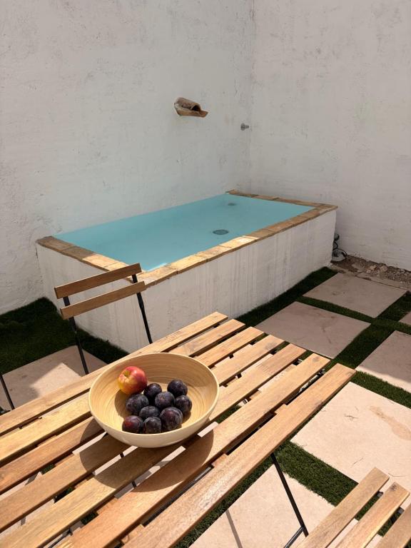 a bowl of fruit sitting on a table at Casa Purissima in Ontinyent