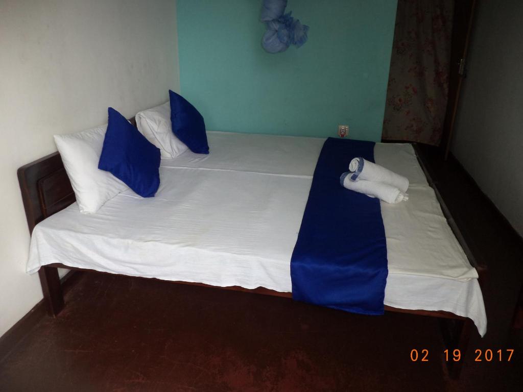 Postel nebo postele na pokoji v ubytování Raja174 Homestay