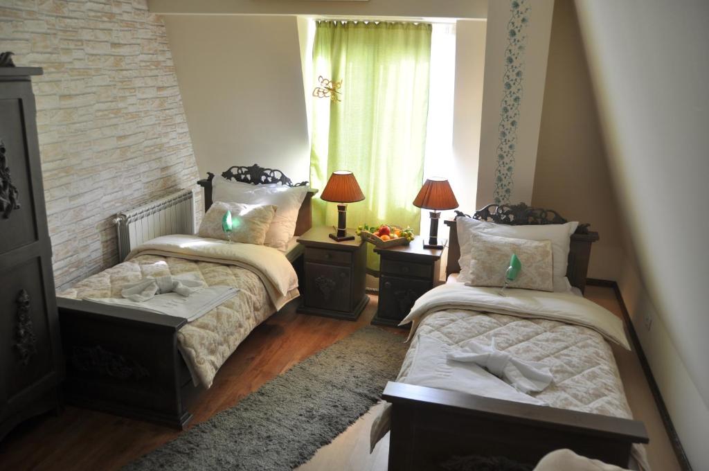 Postel nebo postele na pokoji v ubytování Vila Hit