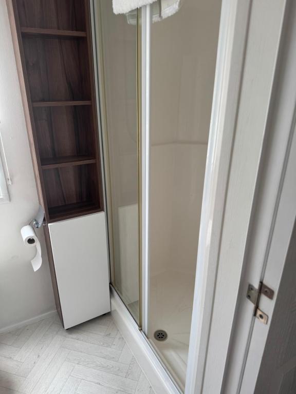 a bathroom with a shower and a glass door at Nancy staycation in Clacton-on-Sea