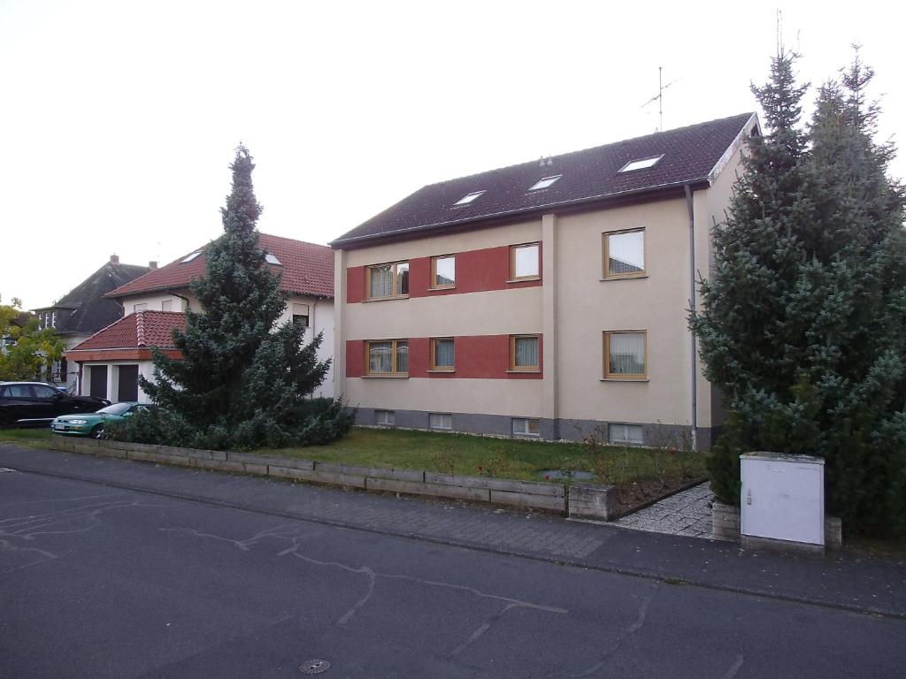 a house with trees in front of a street at Ferienhaus Müller in Unkel