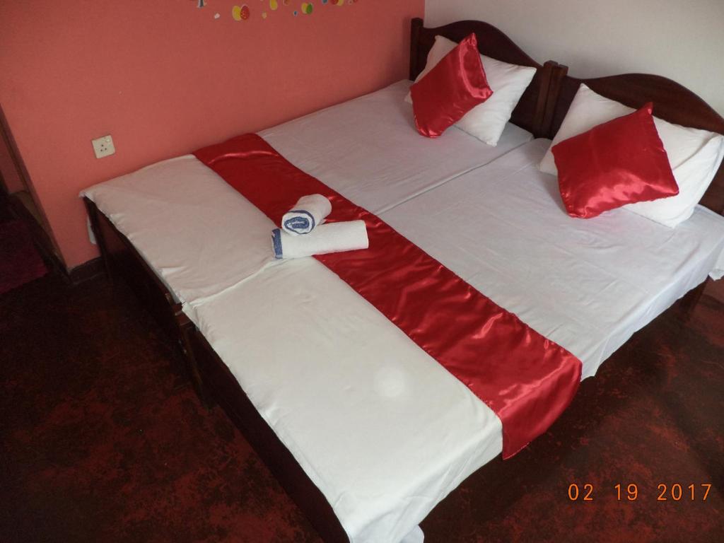 Postel nebo postele na pokoji v ubytování Raja174 Homestay