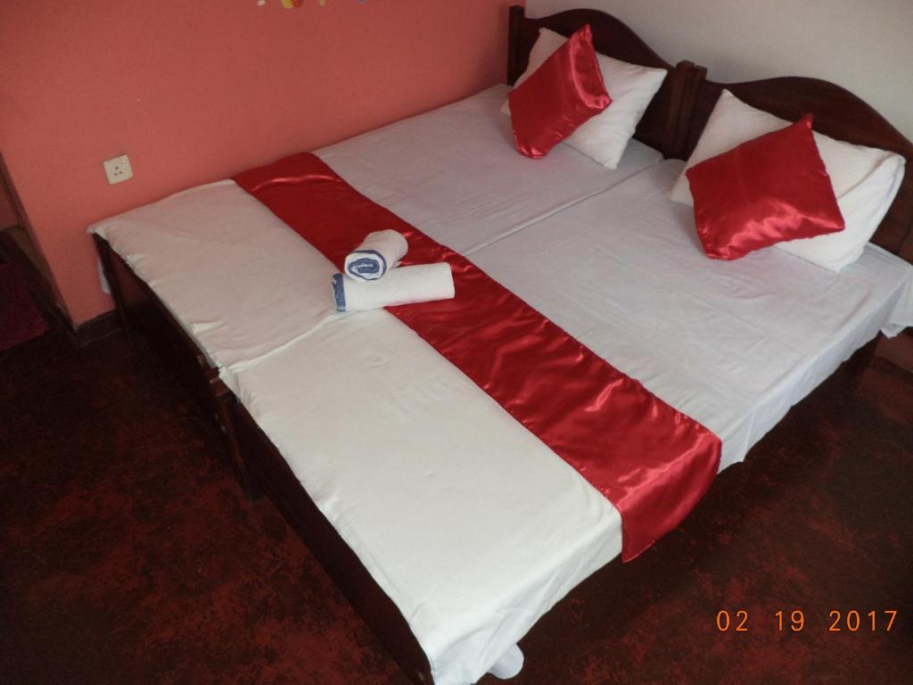Postel nebo postele na pokoji v ubytování Raja174 Homestay