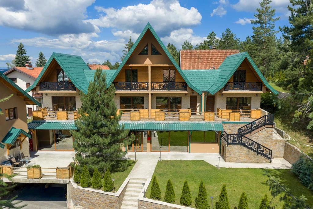 an aerial view of a house with a green roof at Brvnara Mont 3 in Zlatibor