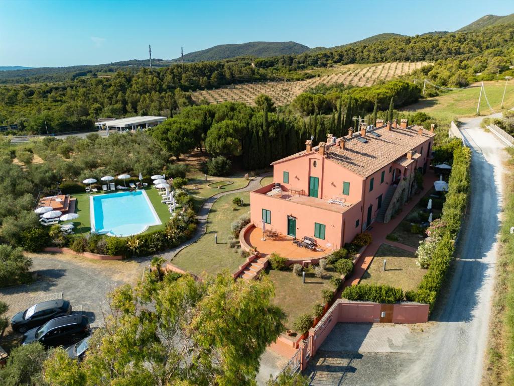 an aerial view of a house with a pool at My Tuscany Suites in Castiglioncello