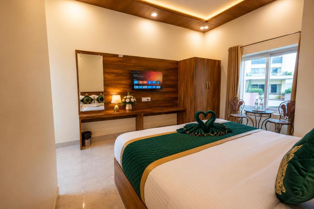 a bedroom with a large bed with a mirror at Hotel Ganga MBS Rishikesh # Best location # Family Hotel in Rishīkesh
