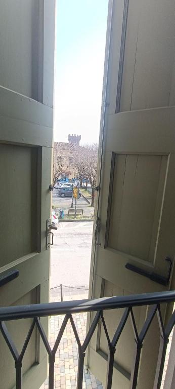 an open door of a building with a balcony at Suite IN PIAZZA in Poggio Renatico
