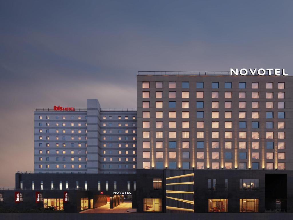a hotel with a sign on top of a building at Ibis Chennai OMR - An Accor Brand in Chennai