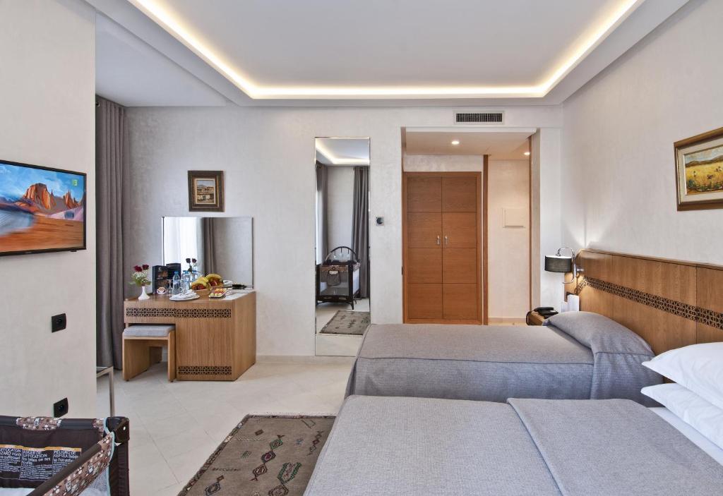 Postel nebo postele na pokoji v ubytování Hôtel l'escale