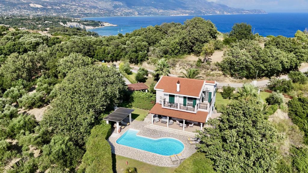 an aerial view of a house with a swimming pool at Villa Hera in Spartià