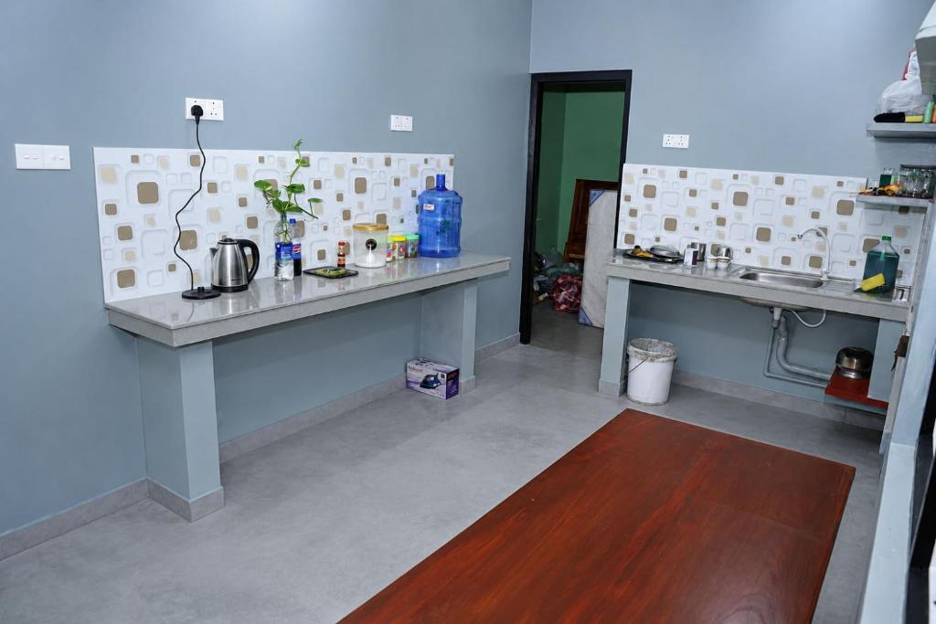 a kitchen with two counter tops in a room at Oasis Guest House in Jaffna