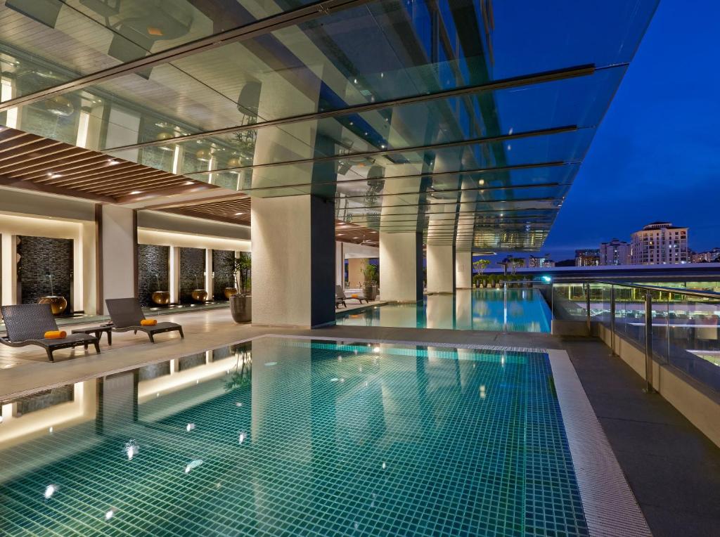 a swimming pool on the roof of a building at VE Hotel & Residence in Kuala Lumpur