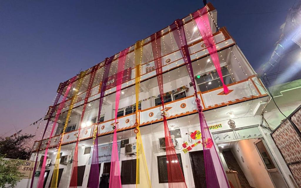 a tall building with a lot of windows at Good Karma B&B in Khajurāho