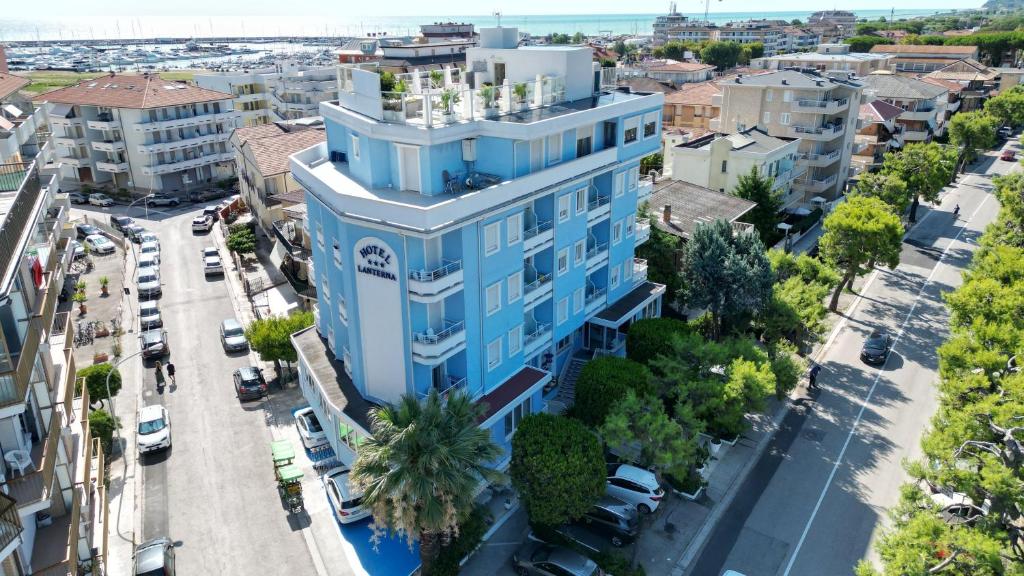 an overhead view of a blue building in a city at Hotel Lanterna in Porto San Giorgio