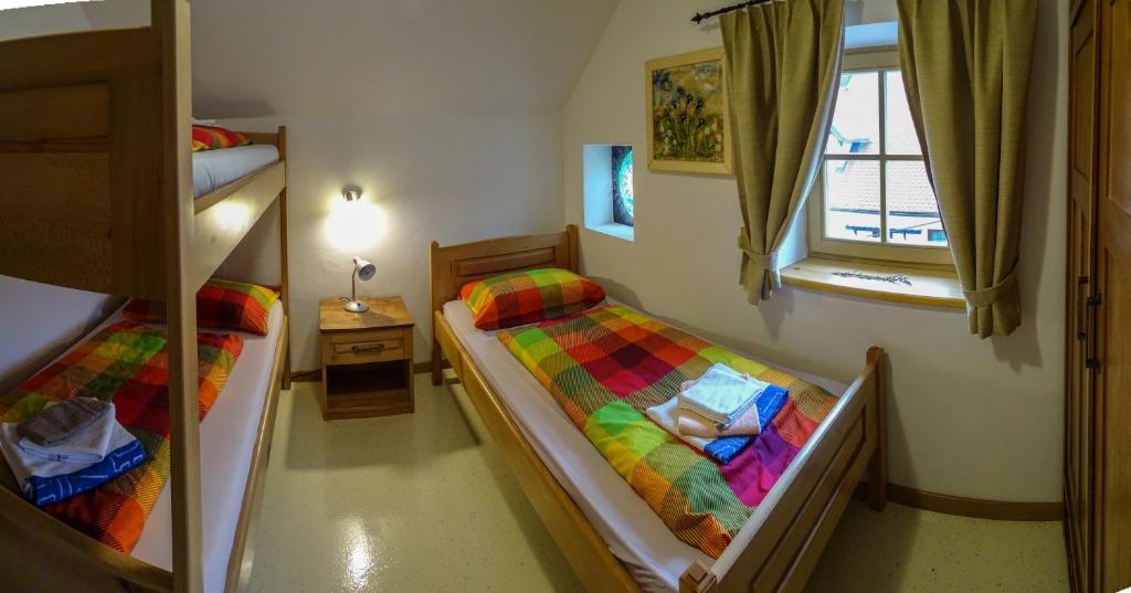 Postel nebo postele na pokoji v ubytování Apartmaji pri Marodnu