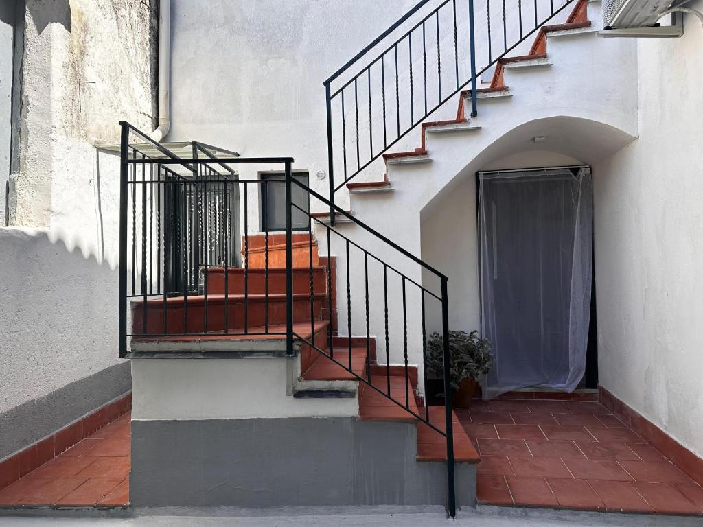 a stairway with a set of stairs next to a building at Tenuta Moffa in Tramonti