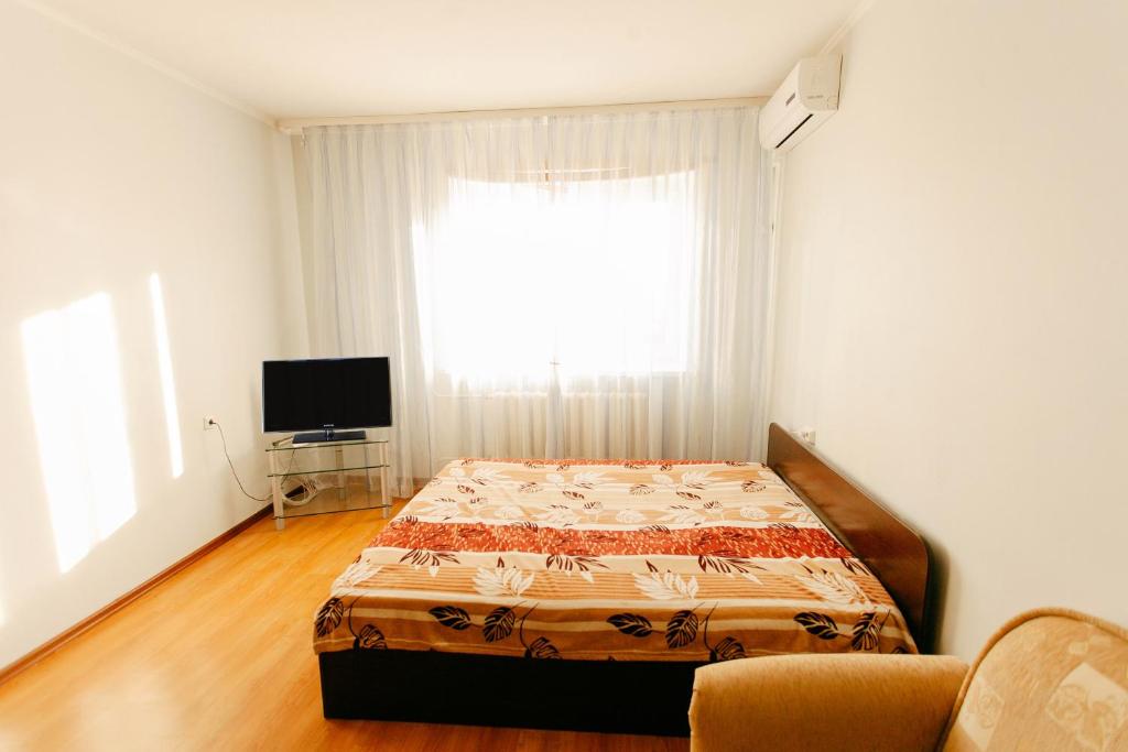 En eller flere senge i et værelse på 1-room Apartment in city Centre on Maksima Gorkogo street 83