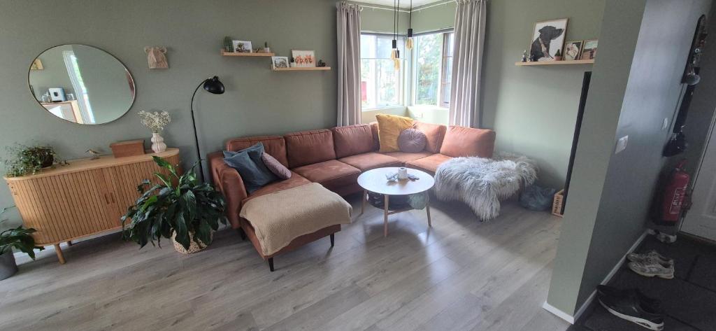 a living room with a couch and a table at Gunnlaugsgata in Borgarnes