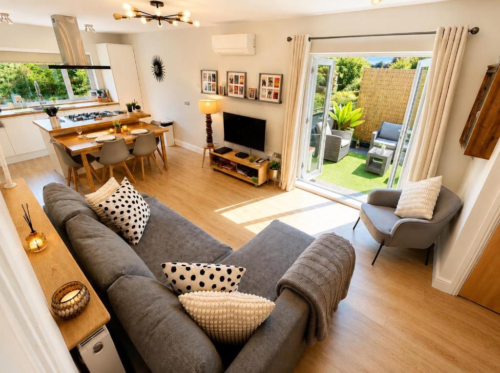 a living room with a couch and a table at Margate Duplex with Private Terrace Air Conditioning The Duplex Margate in Margate