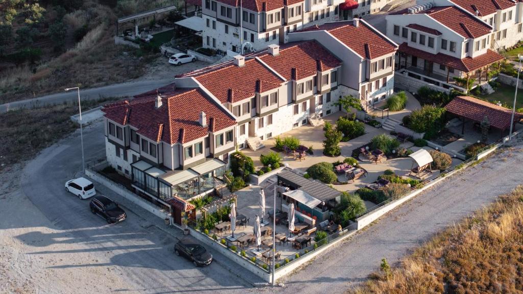 an overhead view of a large house on a street at La Luz Bozcaada in Bozcaada