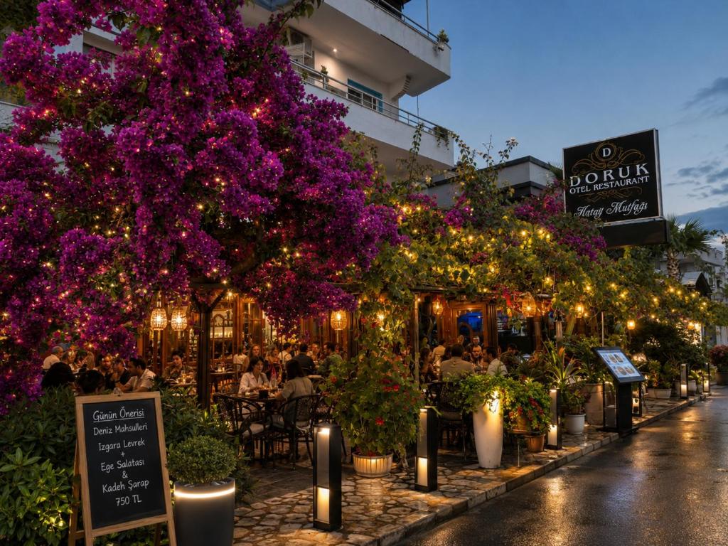 a street with lights and purple flowers and a restaurant at Doruk Hotel in Tıraça