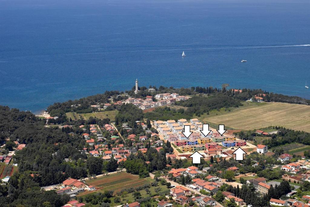 an aerial view of a city and the ocean at Apartmani Svjetionik in Umag