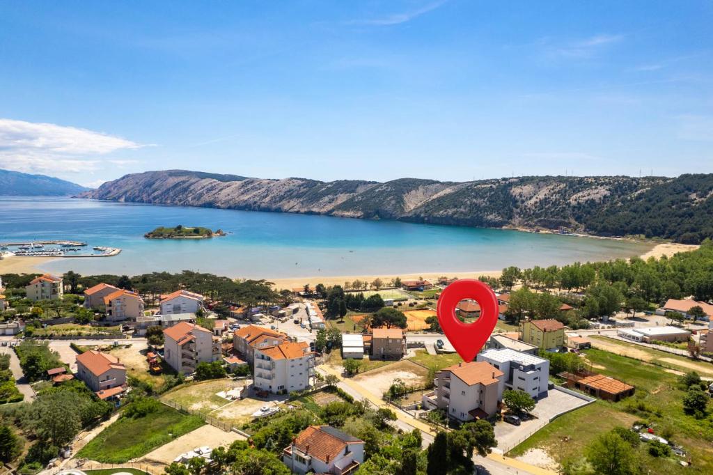 an aerial view of a town with a red balloon at Marin in Lopar