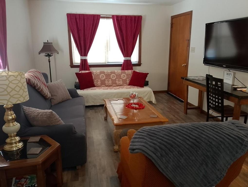 a living room with a couch and a table at Simple Stay in Youngstown
