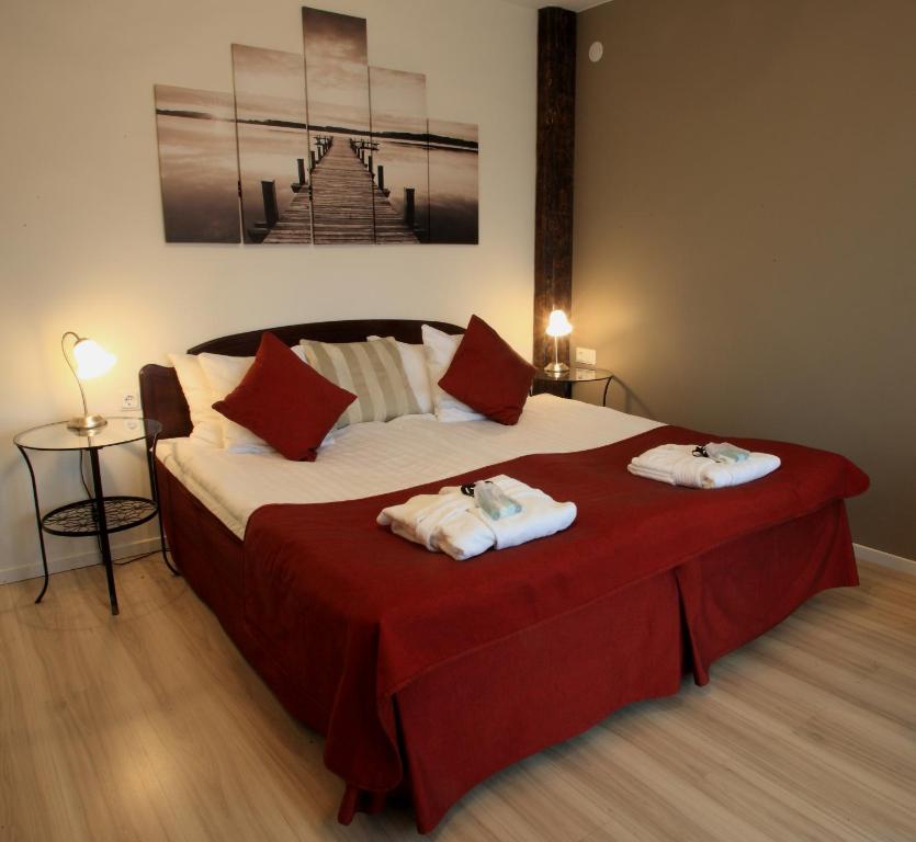 Postel nebo postele na pokoji v ubytování Vejby Strand Hotel
