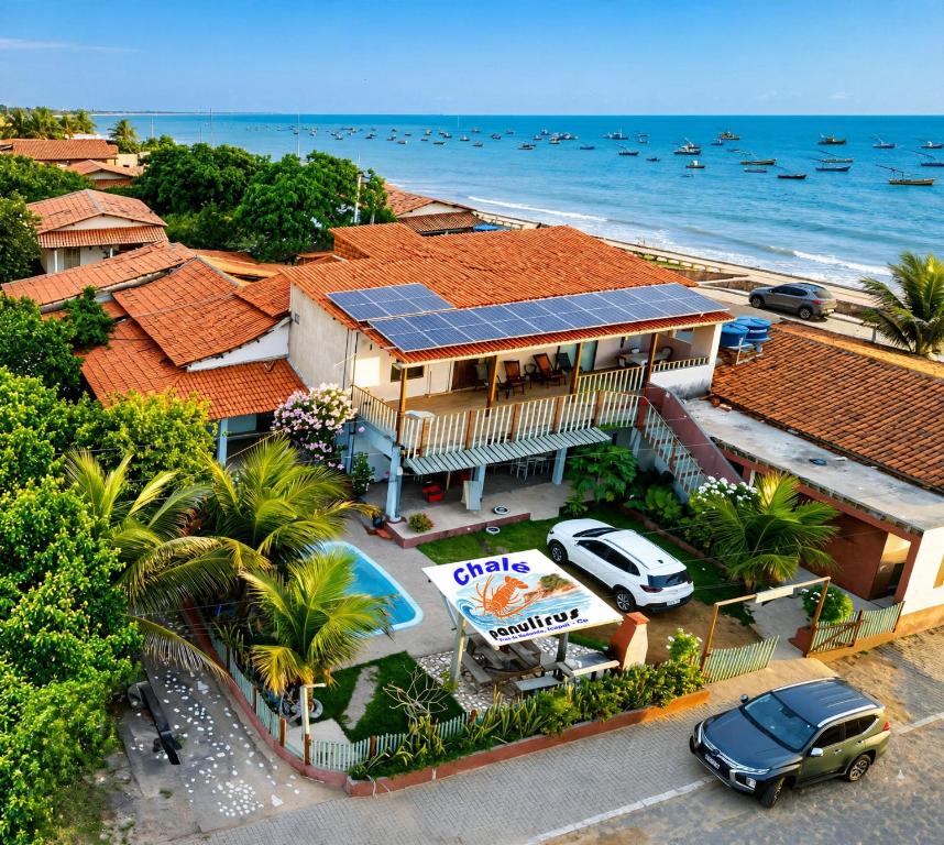 an aerial view of a house on the beach at Chalés Panulirus in Icapuí