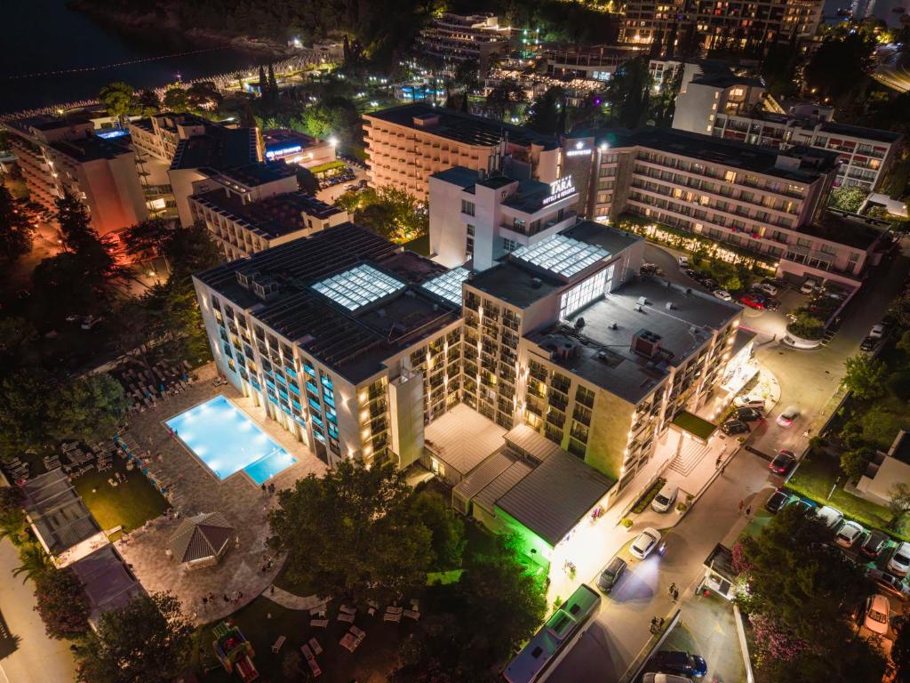 an overhead view of a large building at night at Hotel Tara Becici in Budva