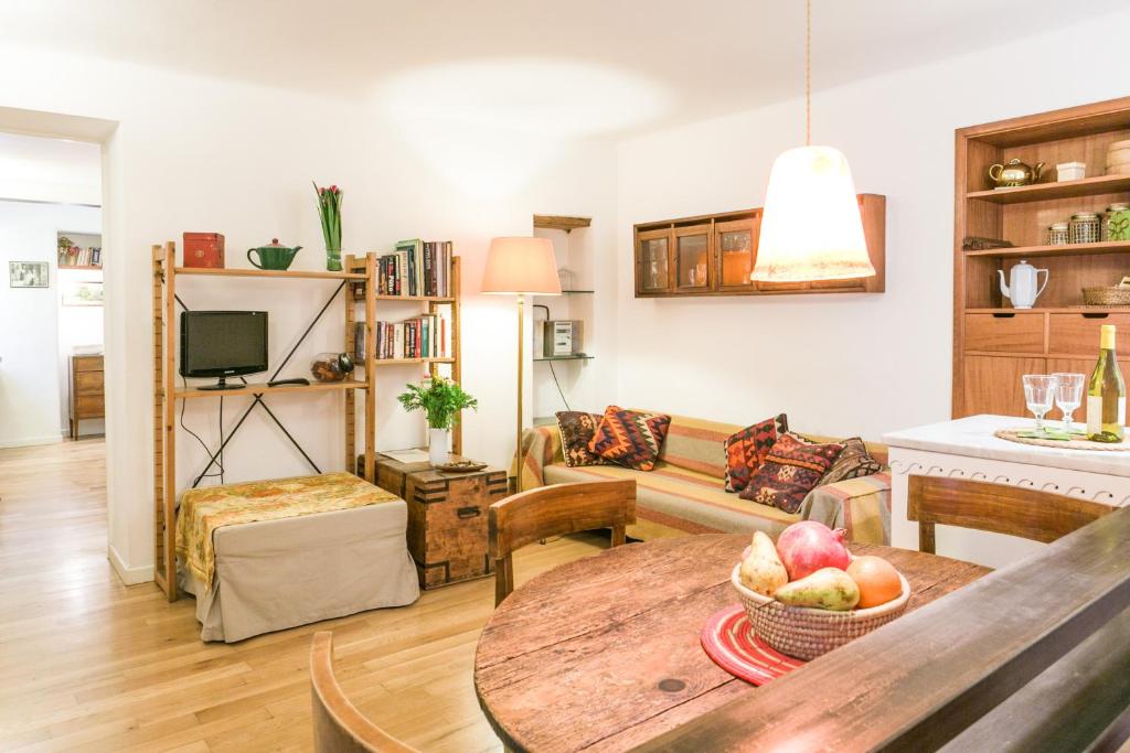 a living room with a table with a bowl of fruit at Navona Stay Apartment in Rome