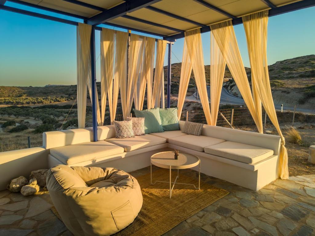 a living room with a couch and a table at Sugarstone House in Adamantas