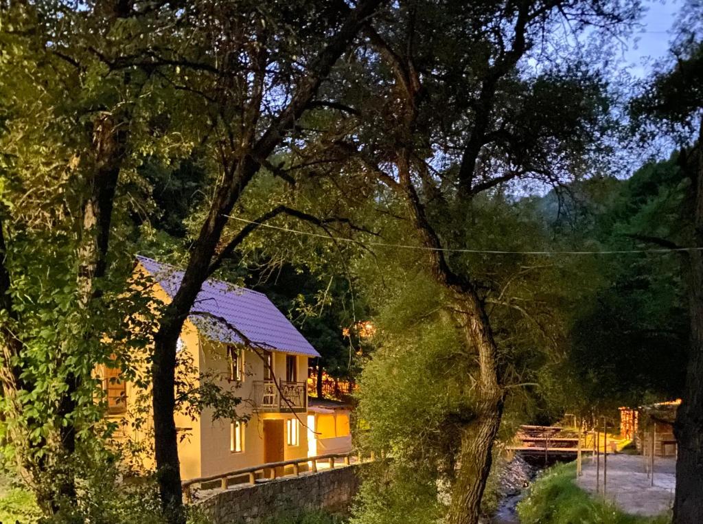 a house in the middle of some trees at Dili Dzor in Dilijan