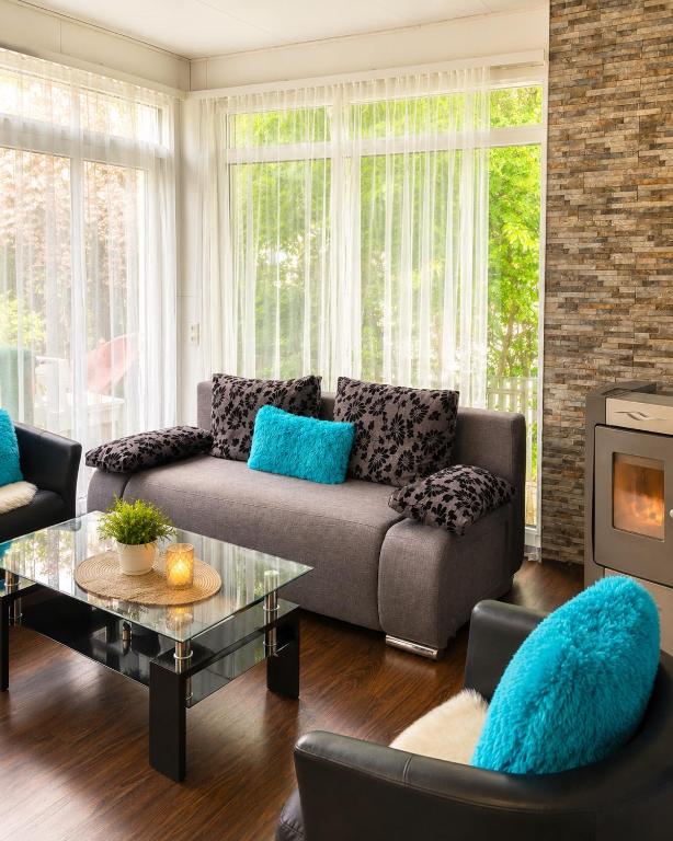 a living room with a couch and a coffee table at Tiny House im Kremstal in Micheldorf in Oberösterreich