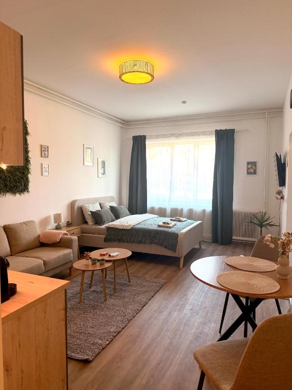 a living room with a couch and a table at Apartments Chloe - Top 4 in Hollabrunn
