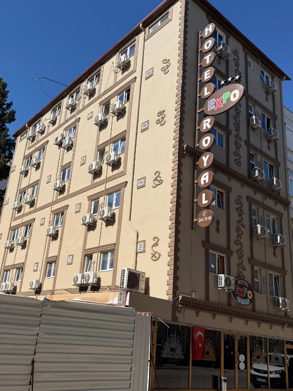 a large building with a sign on the side of it at Exporoyal Hotel in Antalya