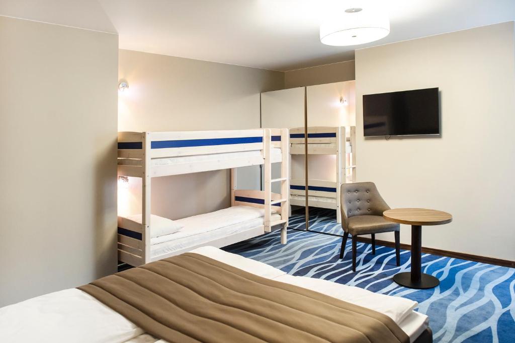 Postel nebo postele na pokoji v ubytování Hotel Porto
