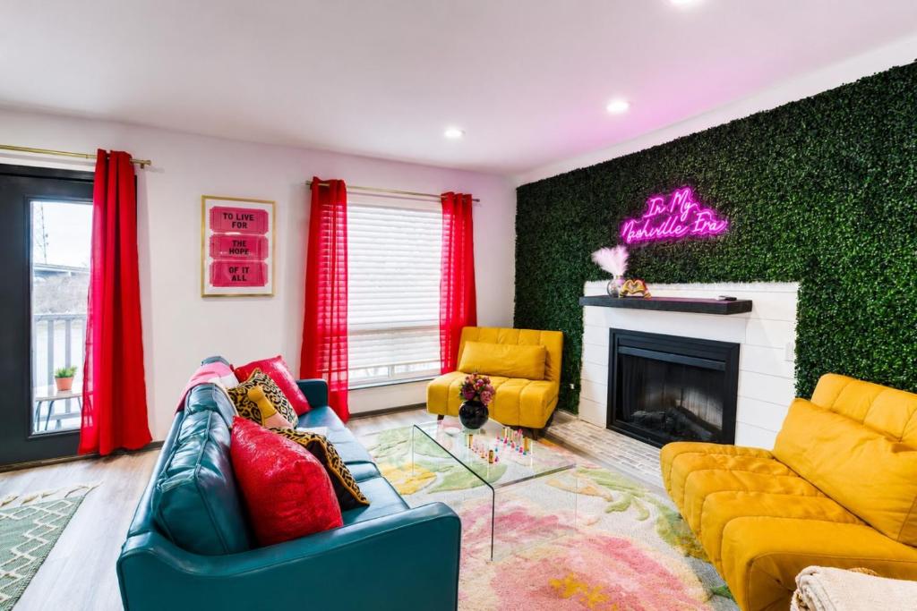 a living room with a couch and a fireplace at Chic Nashville Retreat, River Views and VIP Vibes in Nashville