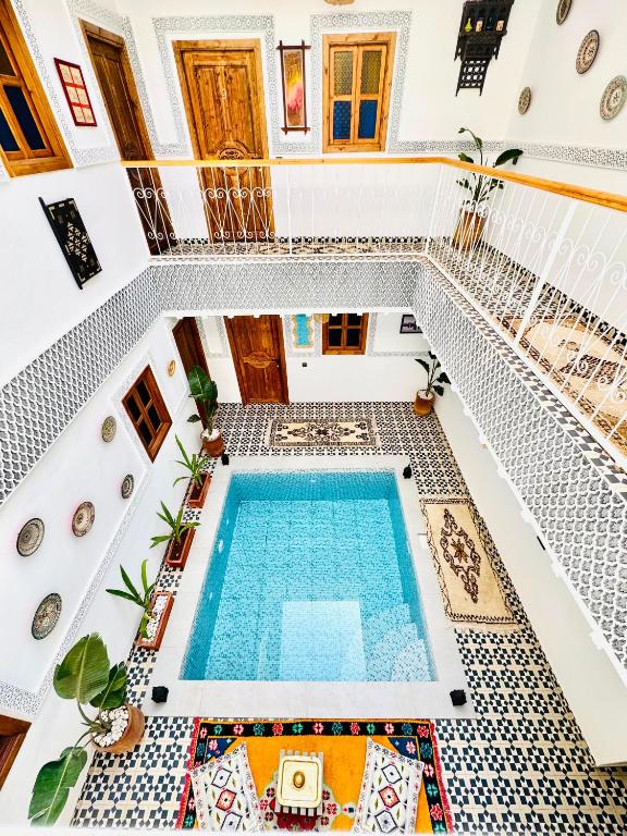 an overhead view of a swimming pool in a house at Riad Le Sultan Rouge And Spa in Marrakesh