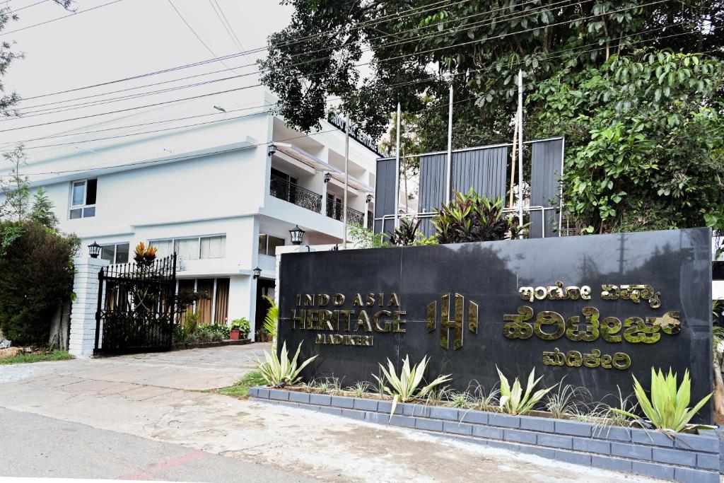 a sign in front of a building at Indo Asia Heritage, Madikeri, formerly Hotel Coorg International in Madikeri