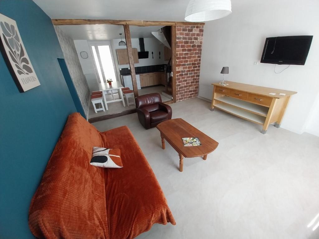 an overhead view of a living room with a bed and a table at Le sabot de Madame in Lussac-les-Châteaux