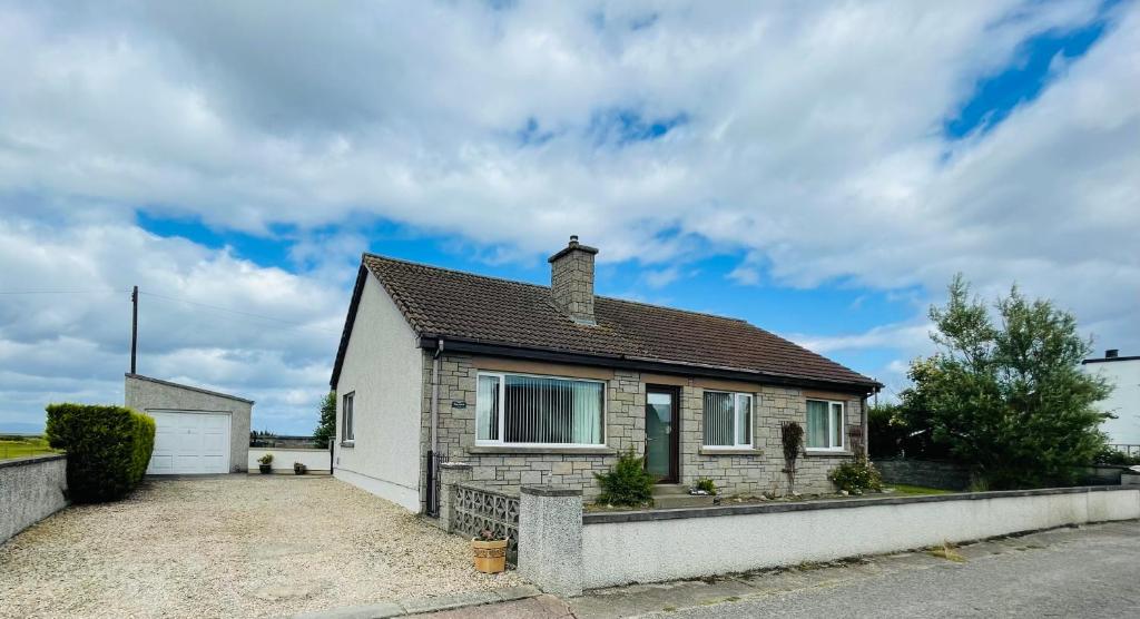 a house with a driveway in front of it at Tigh-na-lios, Inver in Inver