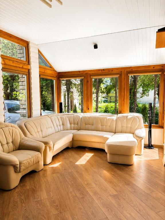 a large living room with a couch and a table at Flower 18 in Jūrmala